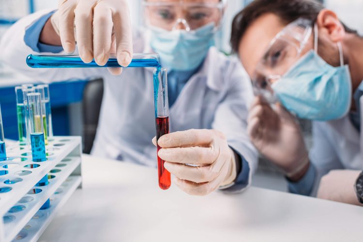 scientists mixing reagents